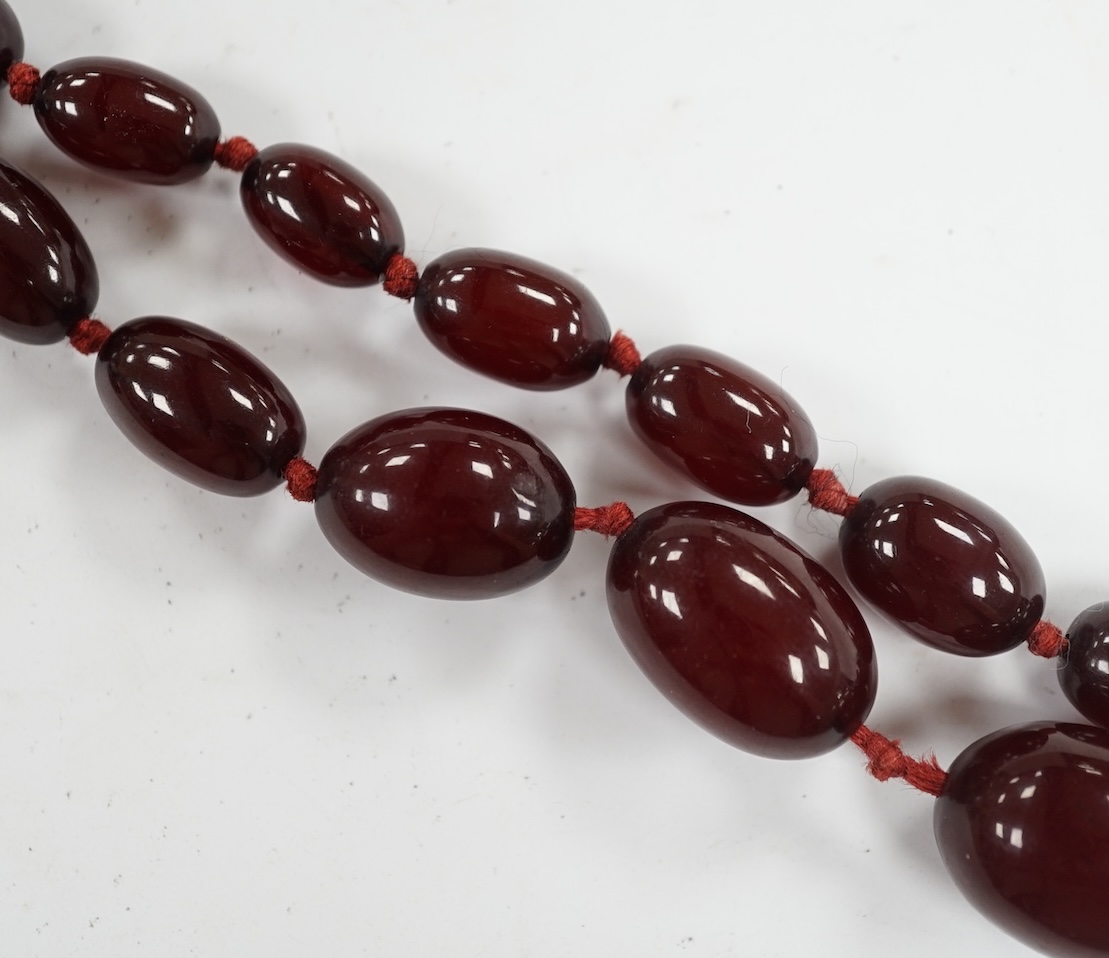 A single strand graduated simulated cherry amber bead necklace, gross weight 66 grams (string a.f.) Condition - poor to fair